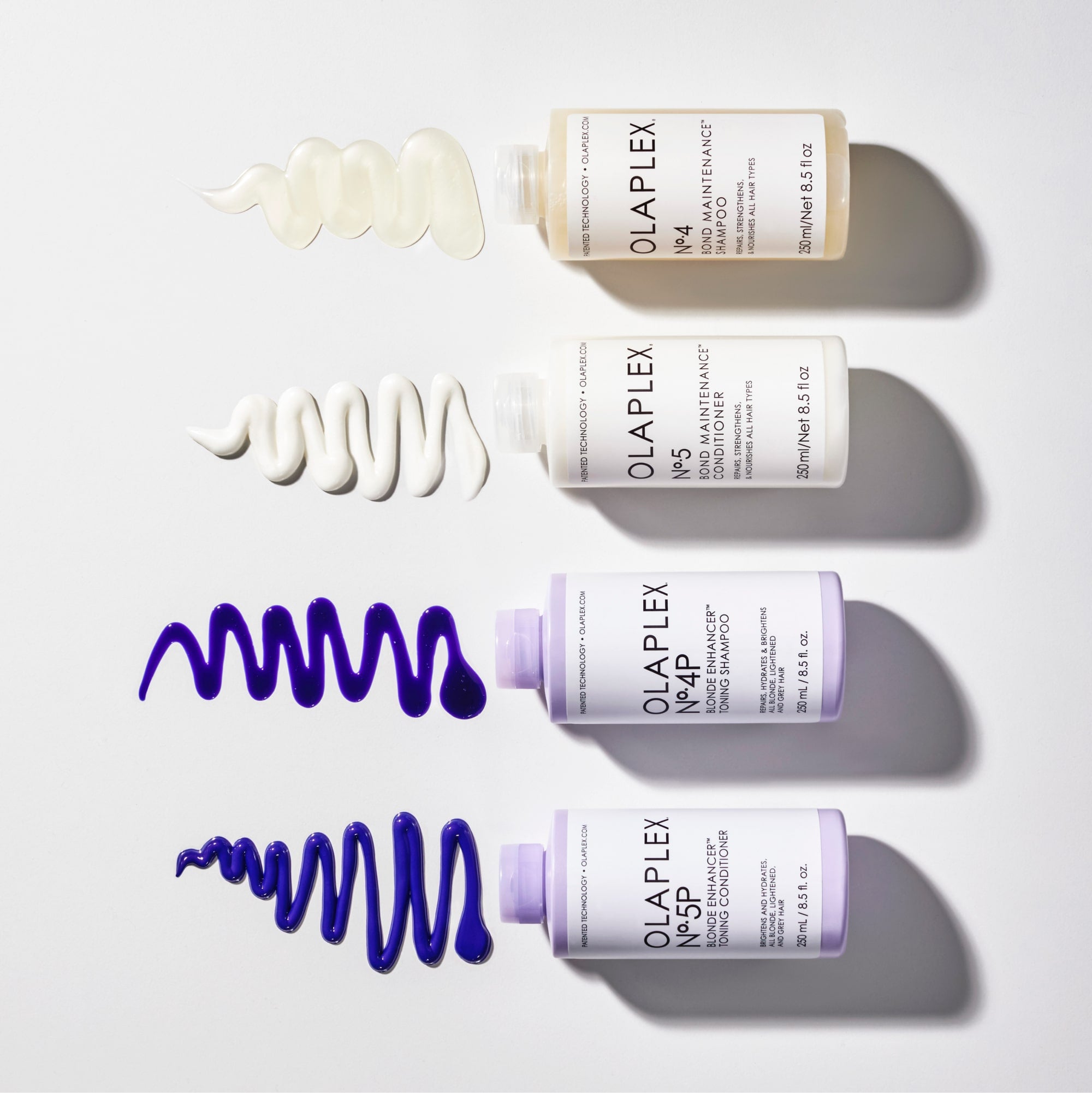 Lineup of  OLAPLEX No.5P Blonde Enhancer™ Toning Conditioner,  OLAPLEX No.4P Blonde Enhancer™ Toning Shampoo,  OLAPLEX No.5 Bond Maintenance® Conditioner, and  OLAPLEX No.4 Bond Maintenance® Shampoo bottles