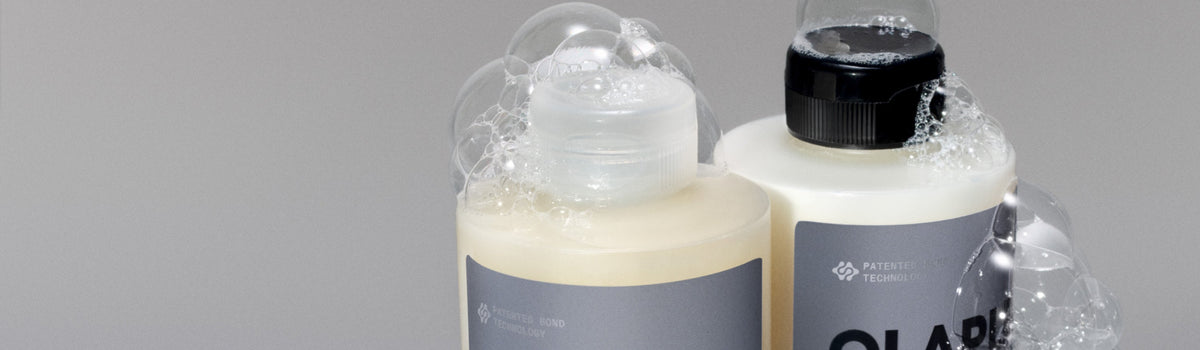 top of 2 bottles with suds