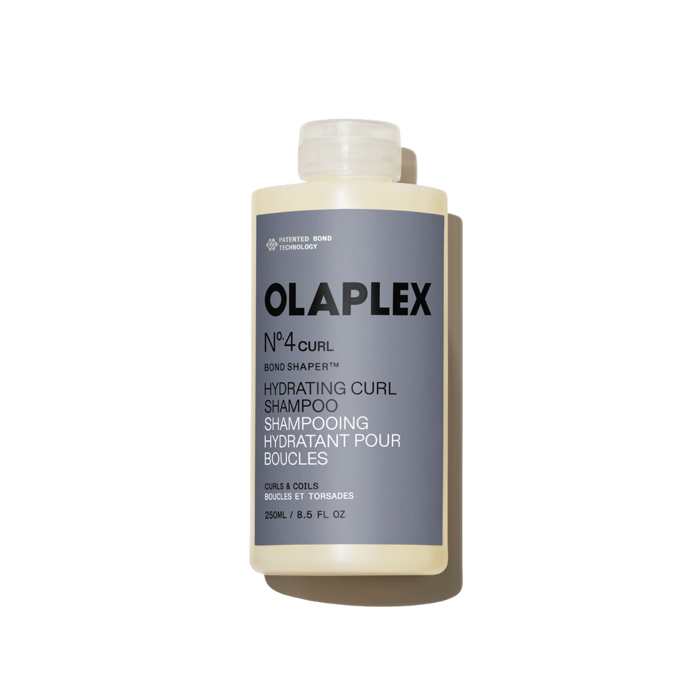 Botella de 250 ml de Olaplex Nº.4CURL Bond Shaper Hydrating Curl Shampoo sobre un fondo blanco liso - main view
