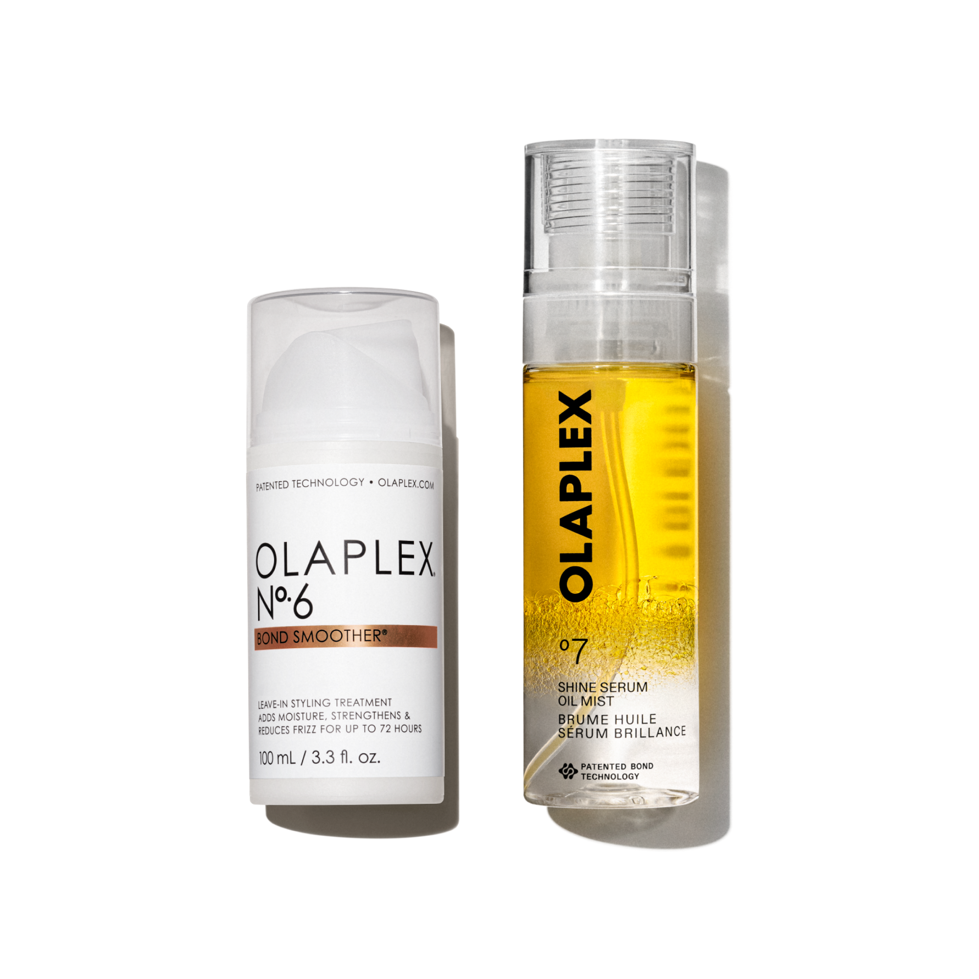 Dos productos para el cabello de Olaplex colocados uno al lado del otro sobre un fondo blanco limpio. A la izquierda está el Olaplex Nº.6 Bond Smoother, un envase blanco con dosificador y tapa transparente. A la derecha hay un envase ligeramente más alto de Olaplex Nº.7 Shine Serum Oil Mist, una botella transparente con pulverizador que muestra en su interior un líquido de un vibrante tono dorado-amarillo. Ambas botellas presentan el diseño minimalista clásico de la marca con letras negras nítidas.